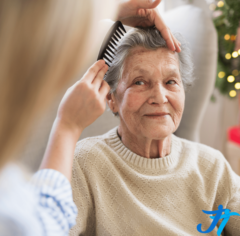 The lady is helping the old woman to comb her hair