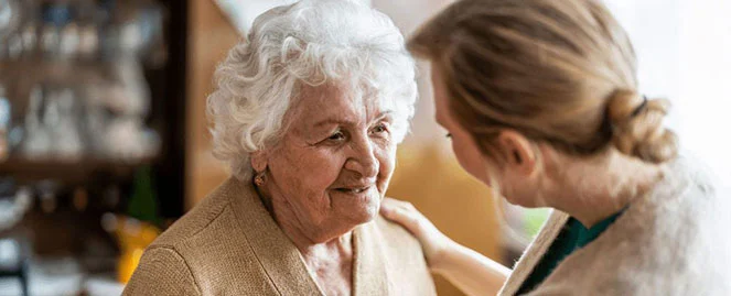 The women is giving motivation to the old woman 